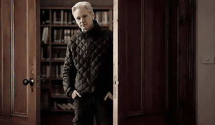 Assange in a doorway